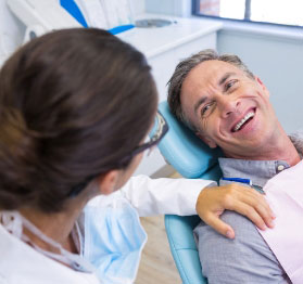 happy patient in dentist chair