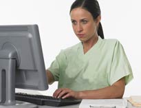 Nurse searching computer